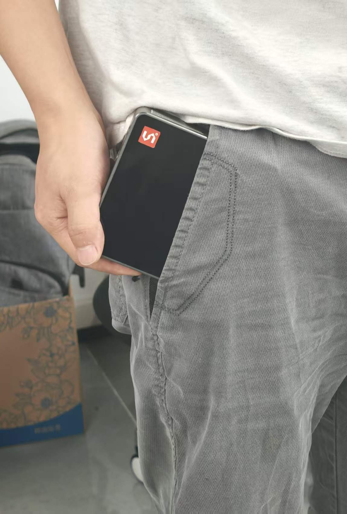 MaixStation sliding into a trouser pocket