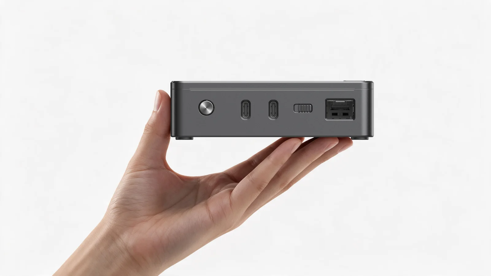 MaixStation held in one hand, front panel facing out